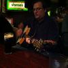 Matt gets to play the famous Irish flag guitar.  Picture courtesy of Connie Marie.